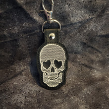 Load image into Gallery viewer, Heart Shaped Eyes Skull Embroidered Keychain
