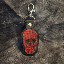 Load image into Gallery viewer, Heart Shaped Eyes Skull Embroidered Keychain
